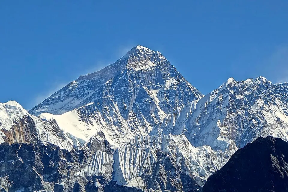 Mount Everest's dark summit pyramid with snow plume, seen from Gokyo Ri, Nepal